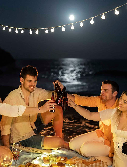 friends-celebrating-toasting-beach-night.jpg