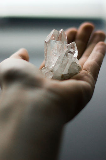person holding crystal stones_edited.jpg