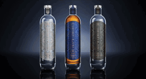 A darkly lit photograph of three bottles of rum