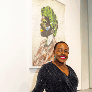 Sharon Walters, 2019 winner of the Reach Prize standing in front of one of her artworks