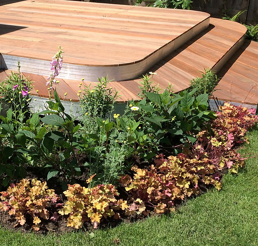 Hardwood deck with curved corners and aluminium fascia, Thames ditton