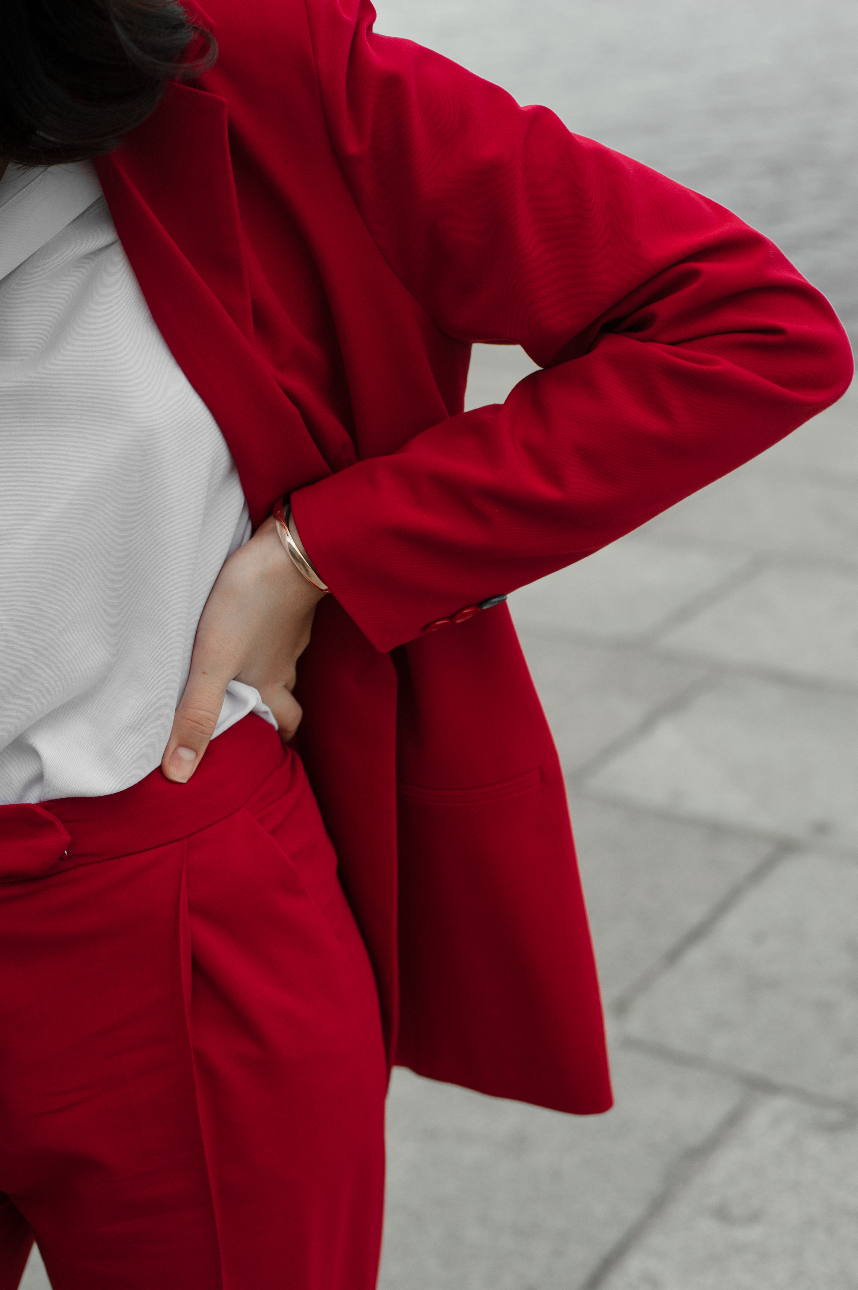 Woman in Red Pant Suit