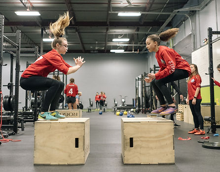 Team of Female Athletes Strength Training