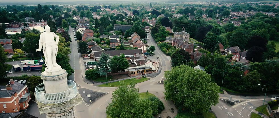 Aerial view of statue overlooking town