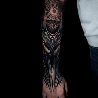 black and grey geometric owl tattoo forearm design with mandala and linework by Graham O’Gorman Hammersmith Tattoo London detailed illustrative realism