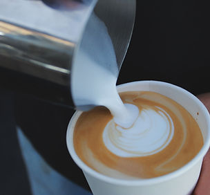Barista pouring latte art