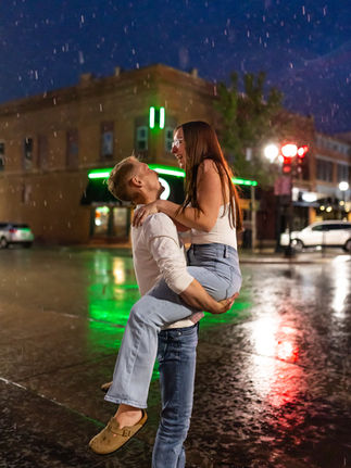 Downtown Main St Cedar Falls Engagement Session Dancing in the rain