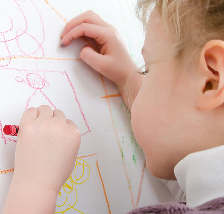Cute little girl drawing with pencil_edi