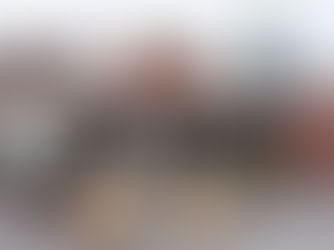 Cargo containers at a European port with compostable packaging cartons being loaded