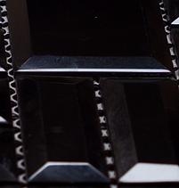 Black glass mosaic with squares and rectangls in a sheet