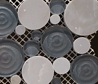 light grey and white circular pebble shapped mosaics