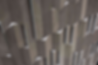 Smooth grey Jagged interlocking rectangular tiles, forming a raised uneven surface