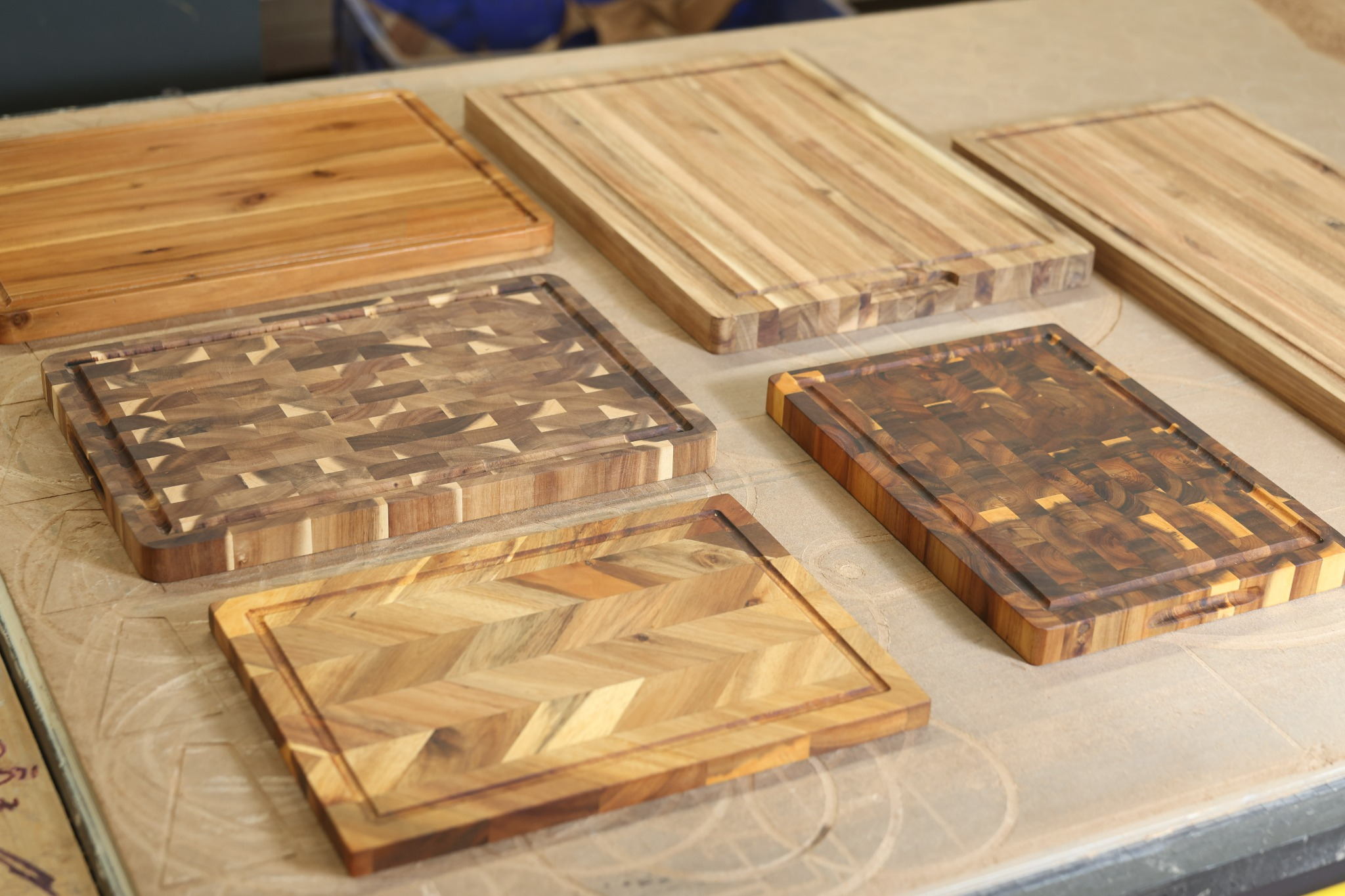 A selection of wooden cutting boards with chevron, end-grain and straight-grain constructions