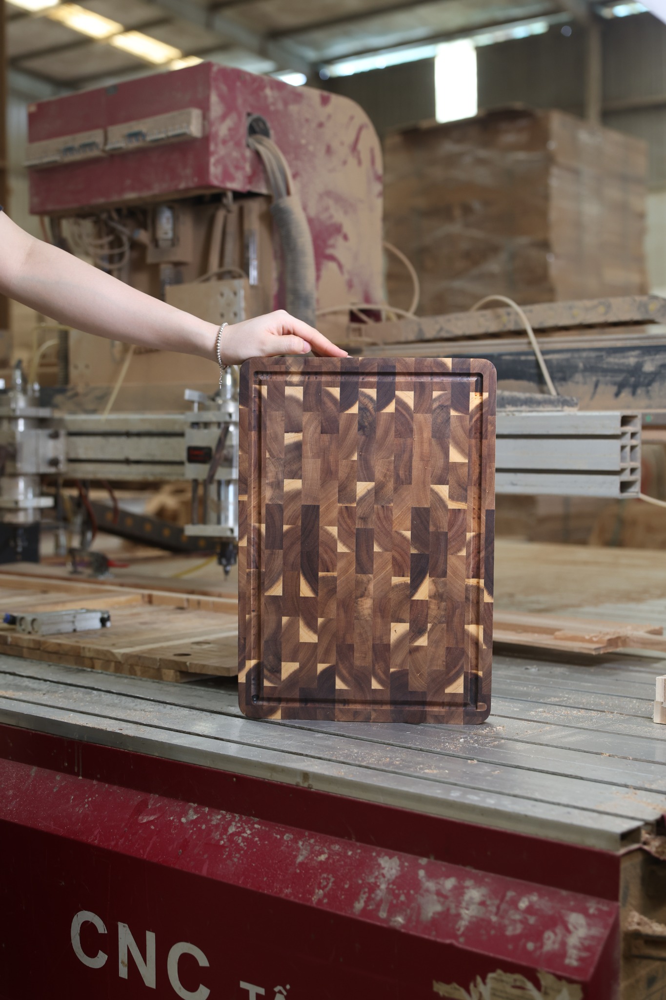 End-grain wooden cutting board held upright to show its block pattern