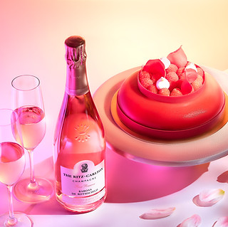 pink chocolate cake with a bottle of Champagne with the label "The Ritz Carlton Champagne"