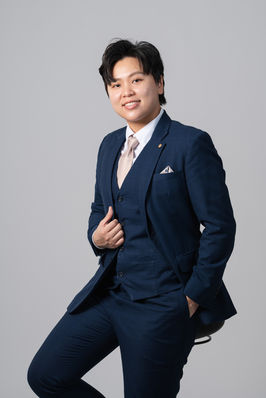 Corporate studio portrait of male executive in navy business suit with soft lighting