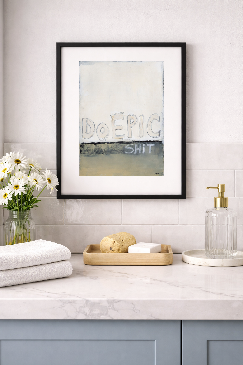 Do Epic Shit motivational mini print in a black 8x10 frame with white mat, styled in a modern bathroom with white towels, dai
