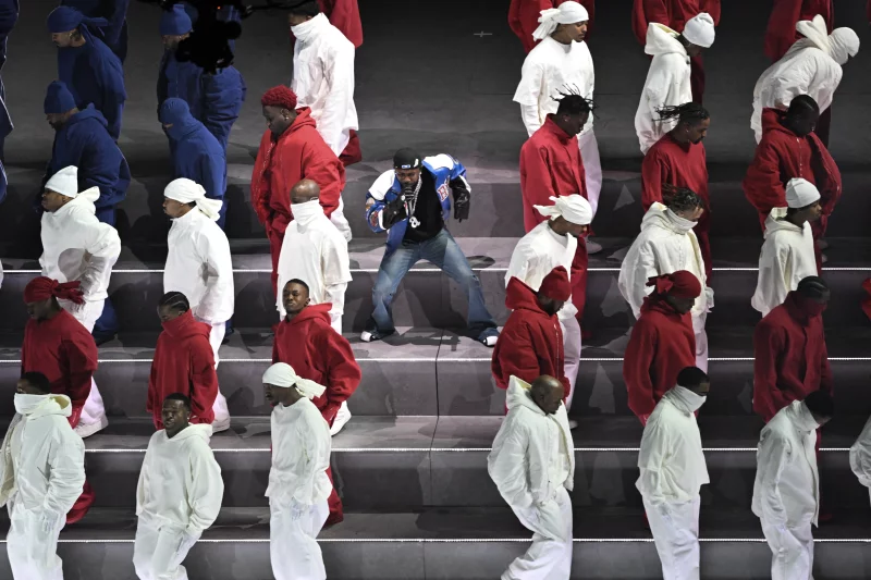 Kendrick Lamar performs alongside dancers dressed in the colors of the American flag during the Super Bowl LIX Chiefs vs Eagles Apple Music Halftime Show at Caesars Superdome in New Orleans, Louisiana.