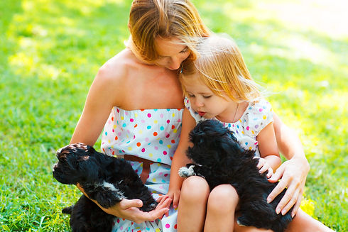 cute-little-girl-and-her-mother-hugging-dog-puppie-2025-01-10-00-17-49-utc.jpg