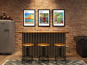 Aperol Spritz, Bloody Mary and Mojito illustrated cocktail recipe posters displayed on a brick-wall home bar setting — original mid-century wall art by Poster Shop Boys, printed on 200gsm premium matte paper