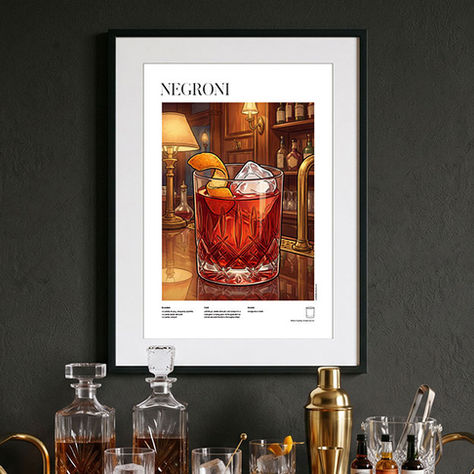 A stylish bar setup features a framed Negroni cocktail illustration recipe poster hanging on a dark wall, illuminated warmly by elegant wall sconces, complementing the display of decanters and cocktail shakers on the sideboard. Shop now!