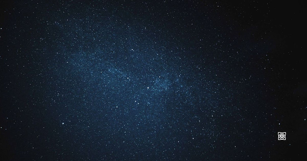 Starry deep-space sky with a blue nebula-like cloud, calm and cosmic.
