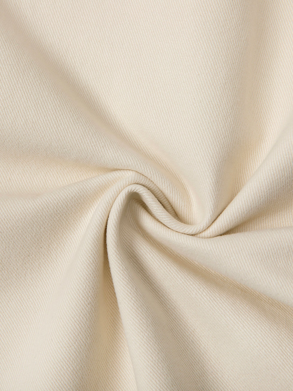 Close-up of beige fabric folded, smooth texture and soft appearance.