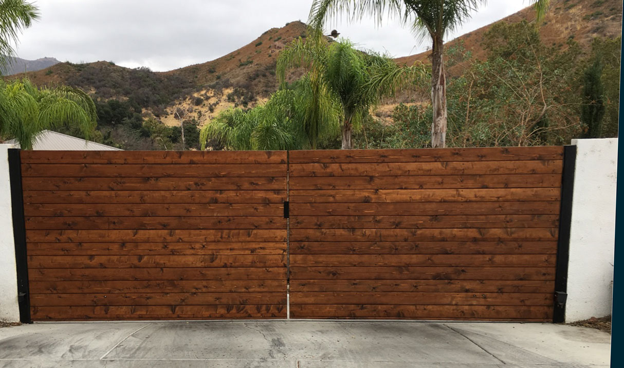 Horizontal cedar wood privacy gate in a black steel frame with mountain views in Agoura Hills, CA
