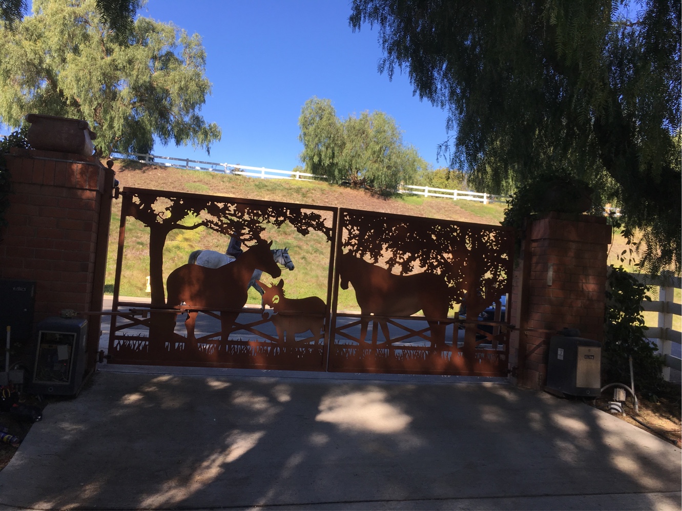 Custom metal ranch gate with laser-cut horse and deer scene in Santa Rosa Valley, CA