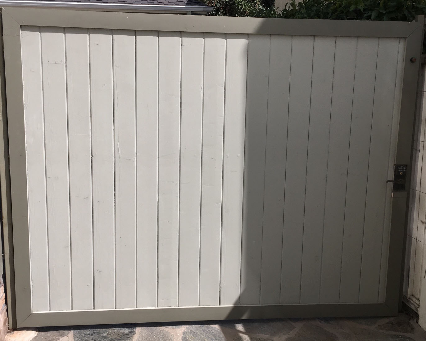 Tan vinyl privacy gate with vertical panels and gray frame in Encino, CA