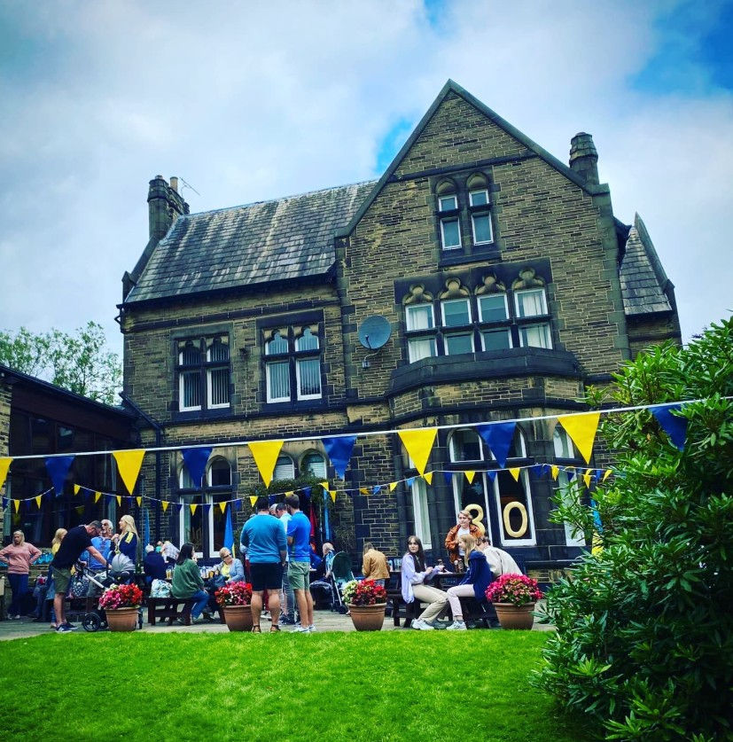 Ukrainian Centre Bradford with blue and yellow flags and people