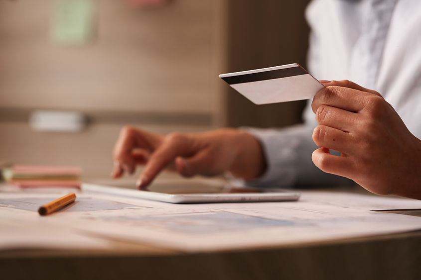 close-up-businesswoman-with-credit-card-checking-her-bank-account-digital-tablet.jpg