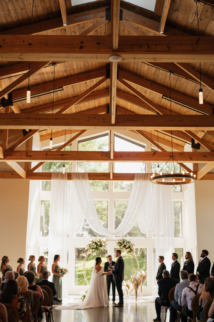 soft ethereal wedding ceremony decor, dry florals, circle alter, indoor wood wedding venue