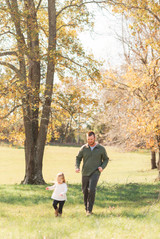 dad and daughter running outside
