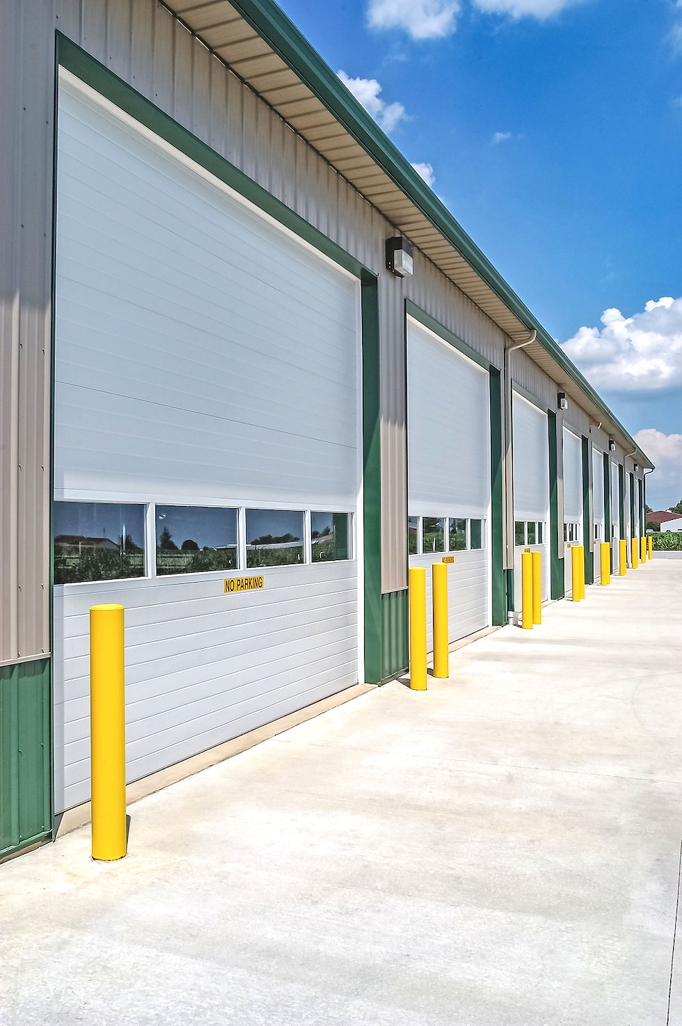 Microgrooved steel commercial garage door with sleek panel design