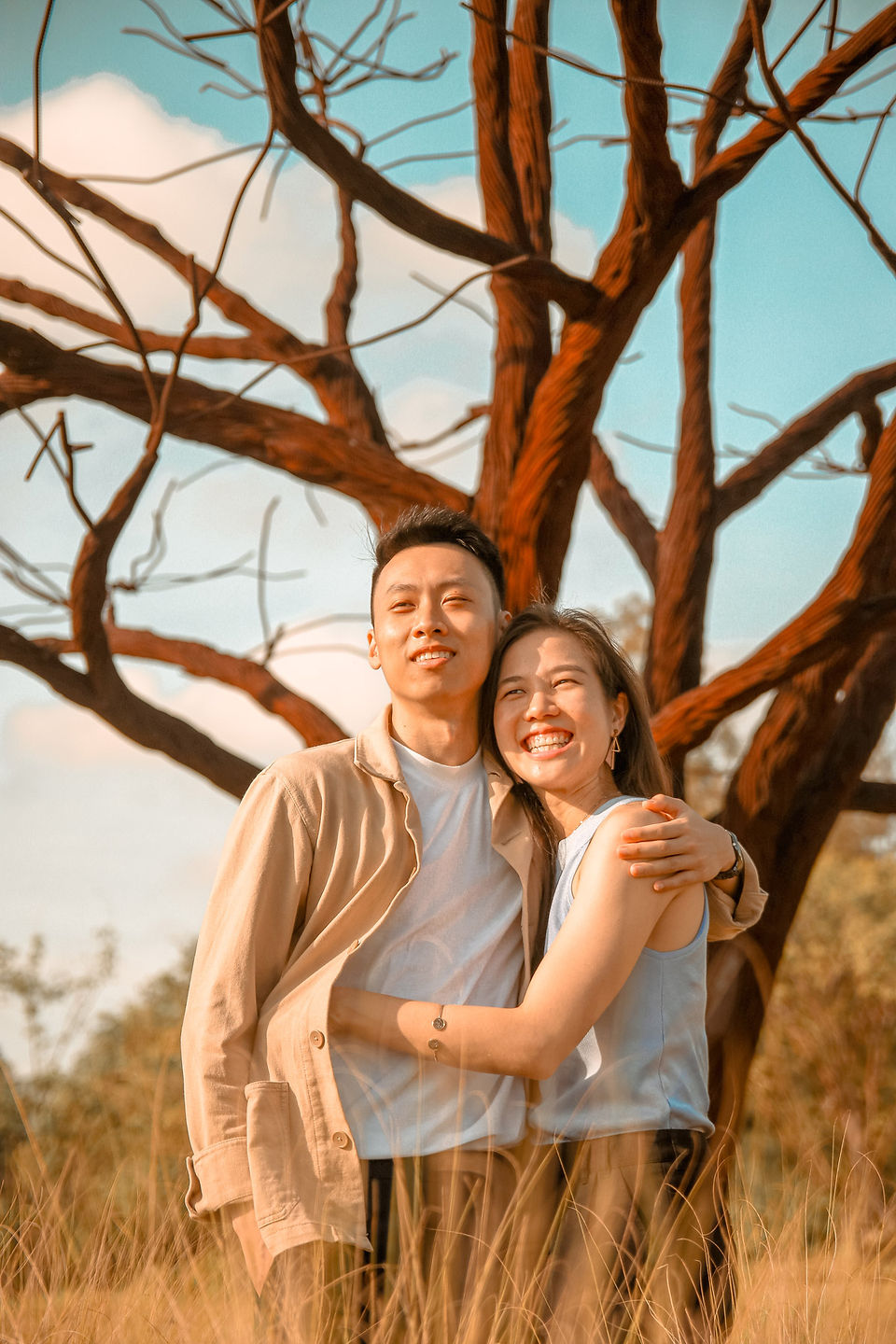 happy-romantic-couple-photoshoot-at-beautiful-nature-fields-and-trees