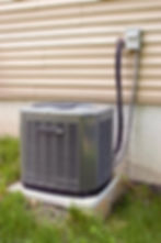 a-residential-central-air-conditioning-unit-sitting-outside-a-home_SYD4KL0rs.jpg