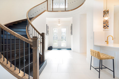 Beautiful black staircase in an open entry hallway