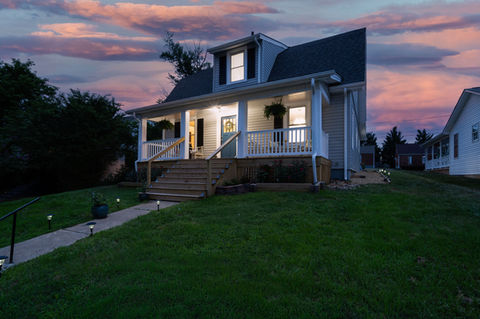Cozy house with porch at sunset in Roanoke, VA.
