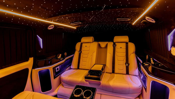 Luxury leather seating with ambient lighting in Mercedes Maybach