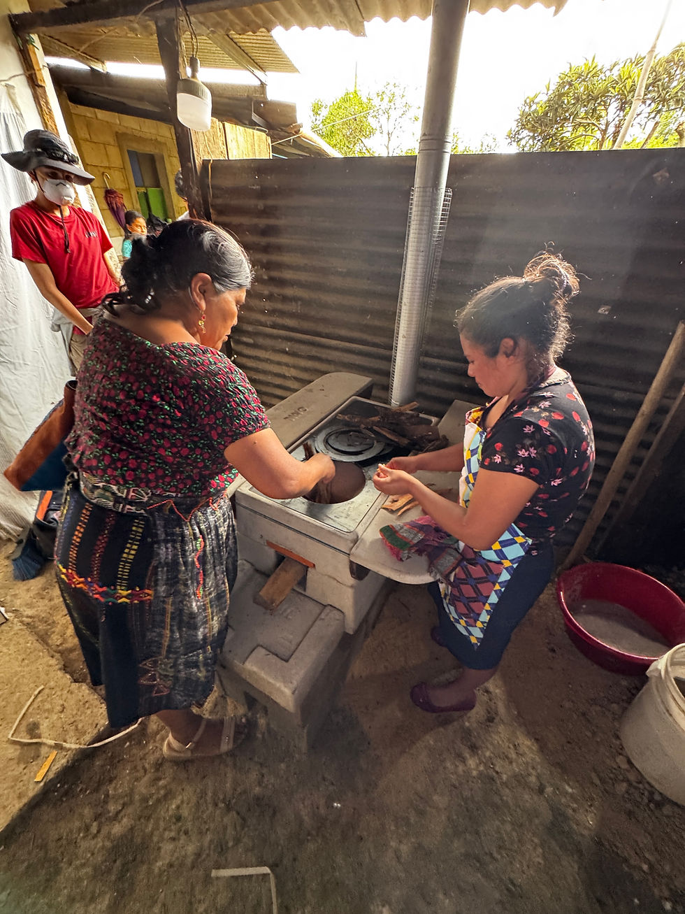 Community members assembling a clean cookstove as part of a Stoves4Change service trip