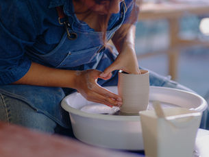 A woman using a pottery wheel