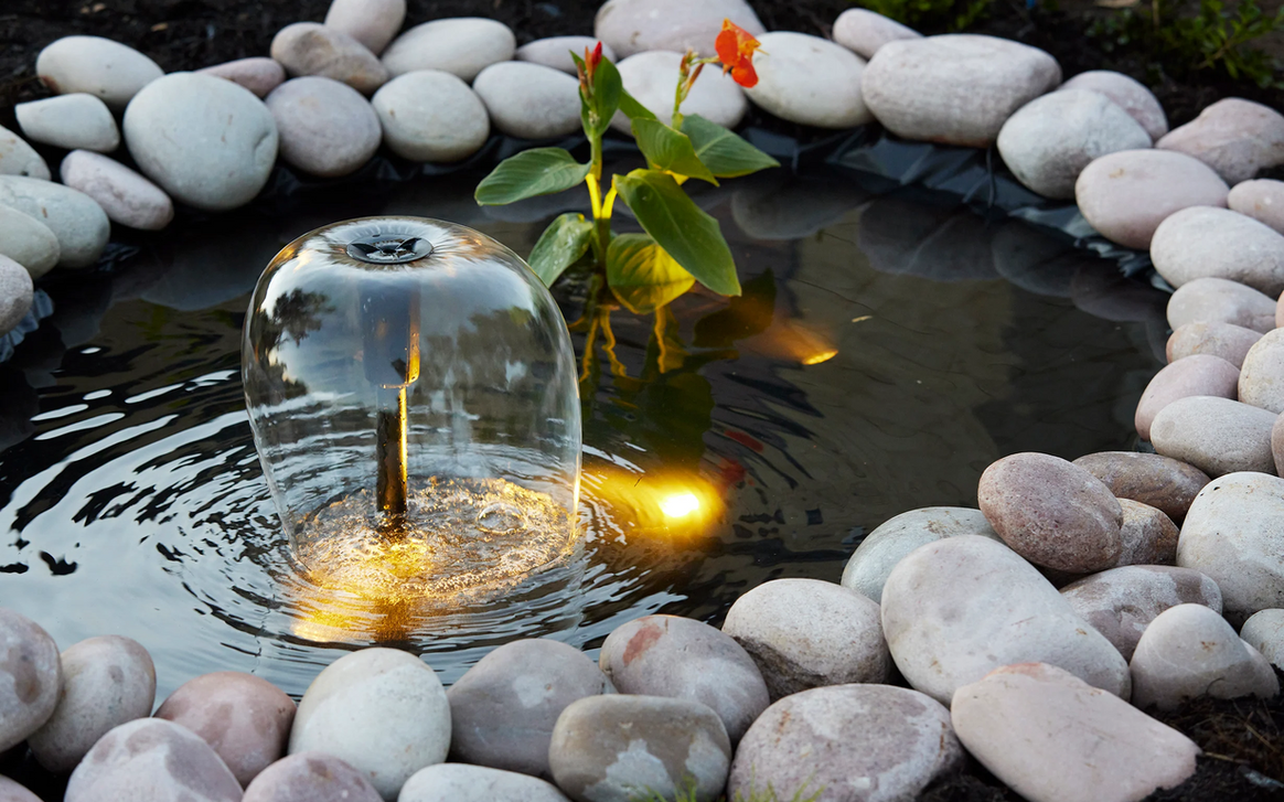 A candle in the middle of a pond