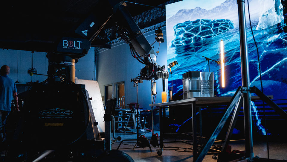 Behind-the-scenes studio shot: camera, LED screen, and product