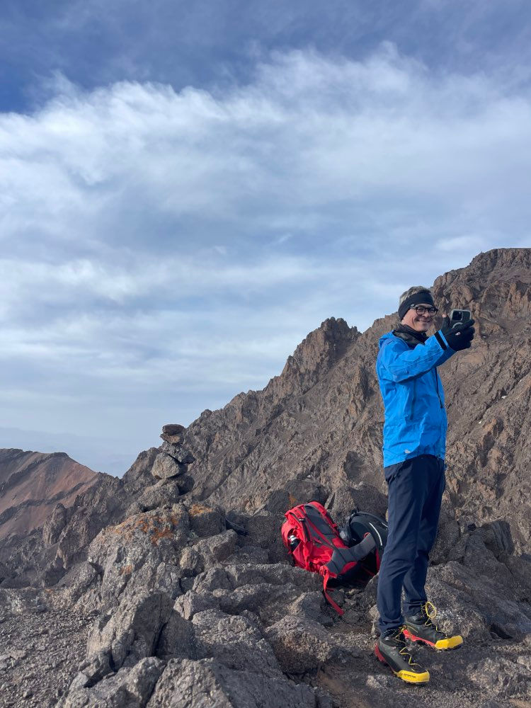 Mountain guide Radouane with client Marco after completing a six-summit High Atlas expedition.