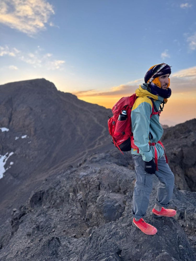 Standing on Toubkal West summit at 4,023 metres.