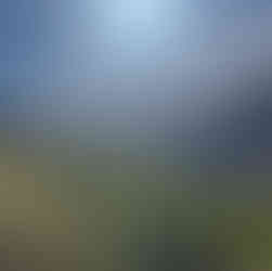 Panoramic view of terraced valleys and mountains in the High Atlas during a backpacking trek around Mount Toubkal.