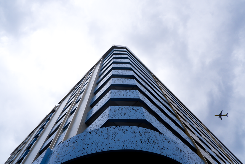 Hongji Gardens in Pasay City showcases a unique architectural style with a focus on open spaces and a connection to the surrounding environment. This image highlights the building's facade, featuring a dynamic design with balconies and a vibrant color scheme. The design reflects a contemporary interpretation of Philippine architectural principles, creating a welcoming and vibrant community atmosphere.