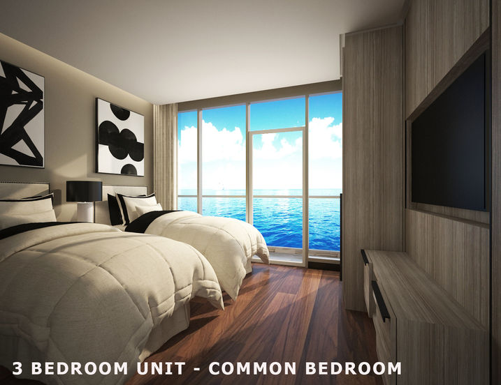 Grand Titanic in Paranaque City offers spacious and comfortable living spaces. This image showcases a common bedroom in a 3-bedroom unit, featuring twin beds, ample natural light, and stunning ocean views. The design reflects a contemporary interpretation of Philippine architectural principles, emphasizing comfort and functionality.