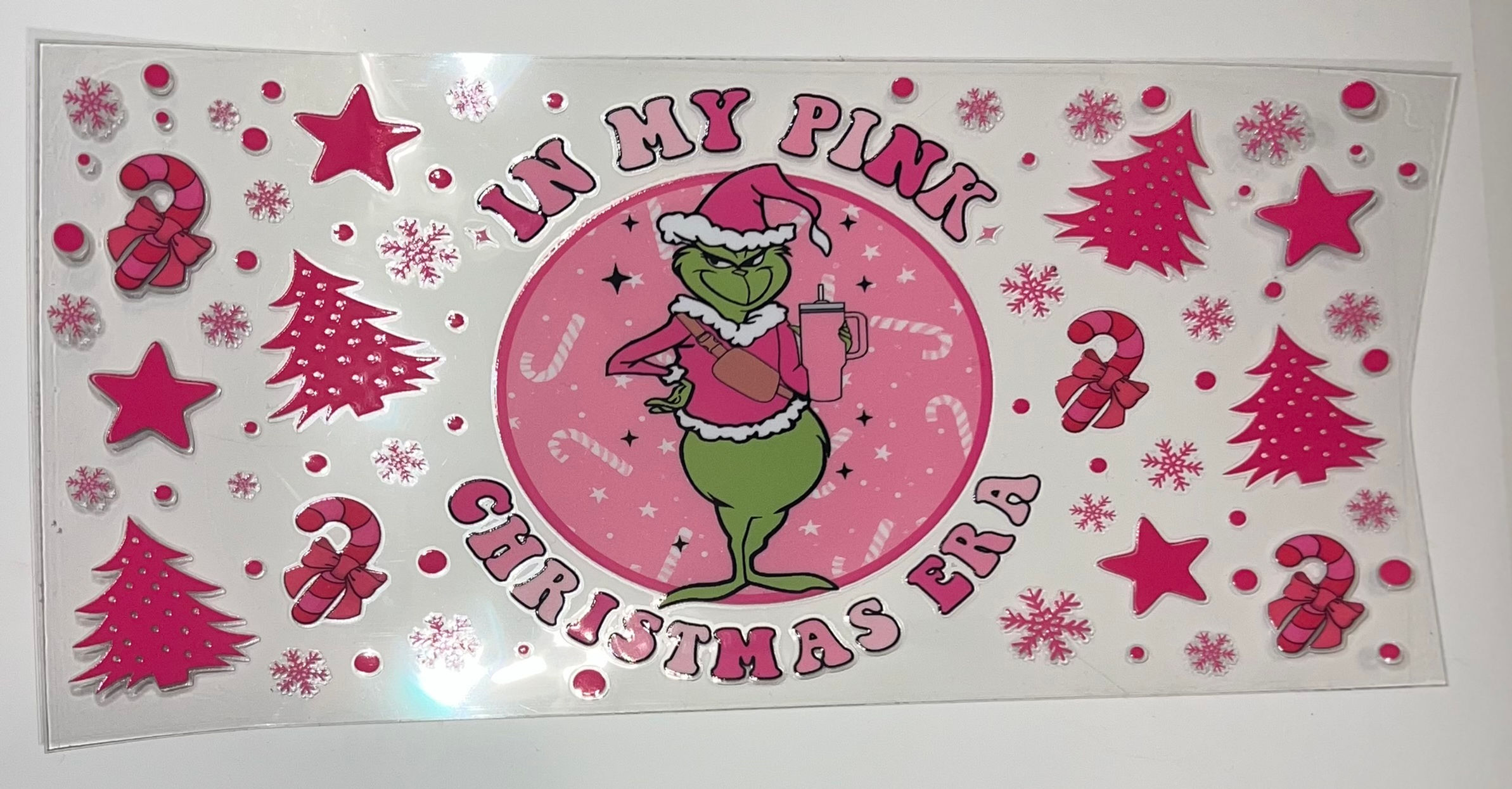 Grinch in pink Christmas outfit, 'IN MY PINK CHRISTMAS ERA'